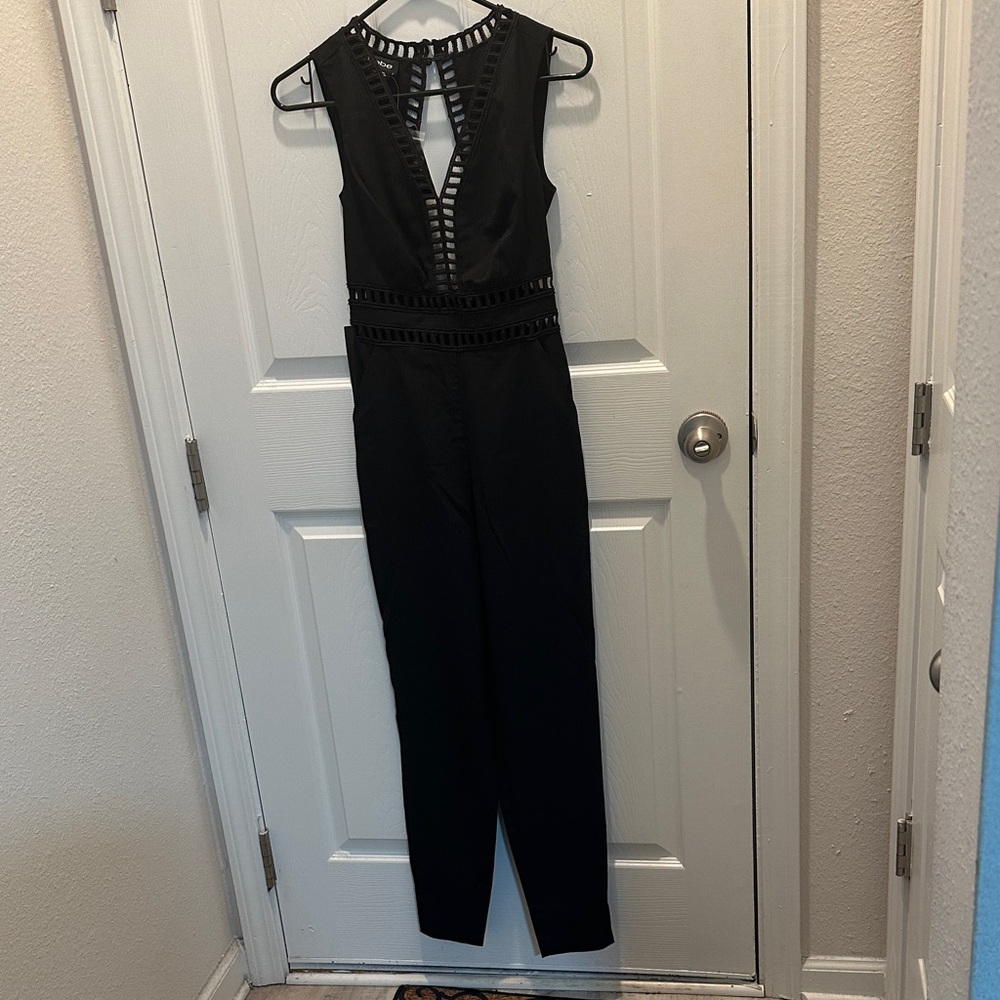Bebe Sleeveless Black Genevieve Jumpsuit with Ladder Trim